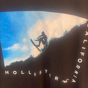Hollister Black Tee with Blue Surfer Graphic